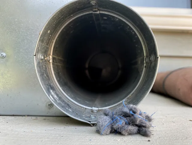 Warwick Dryer Vent Cleaning technician using specialized equipment to clear severe dryer vent blockage in Warwick